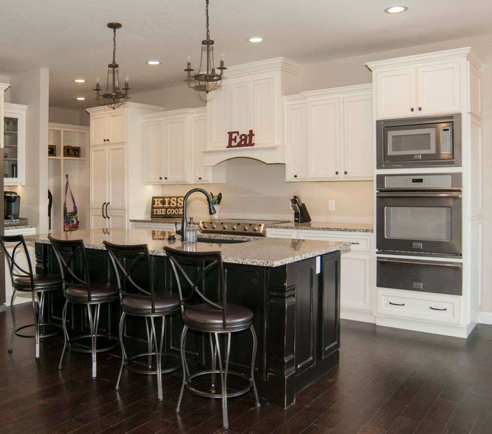 antique white kitchen cabinets with black island